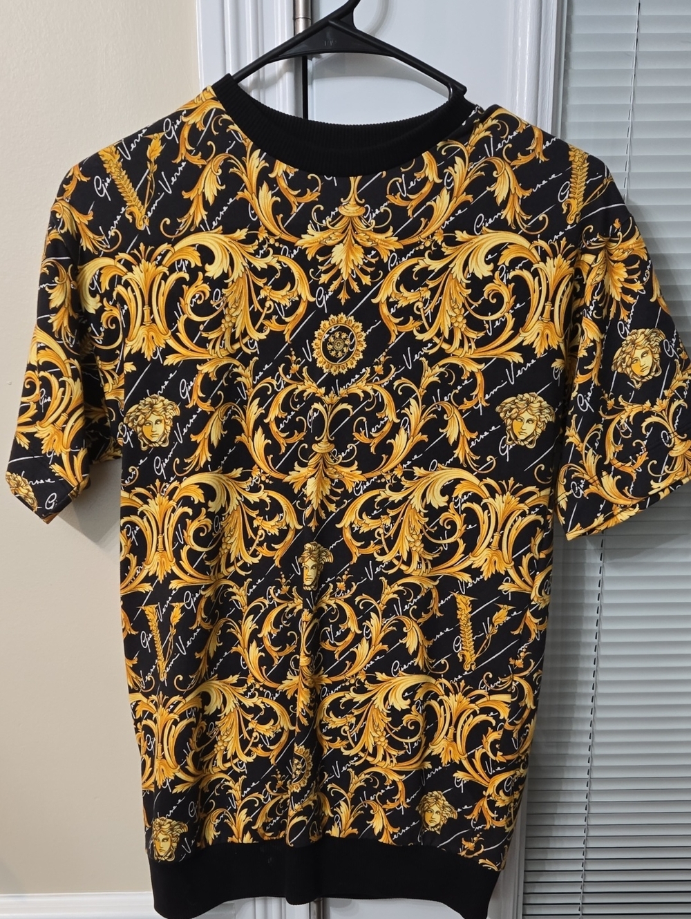 Girl's Black and Gold Baroque Print Short-Sleeve Shirt Dress.